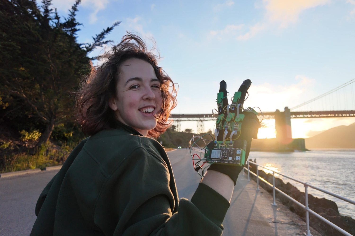 Freesia Gaul demonstrating her virtual reality haptic glove prototype